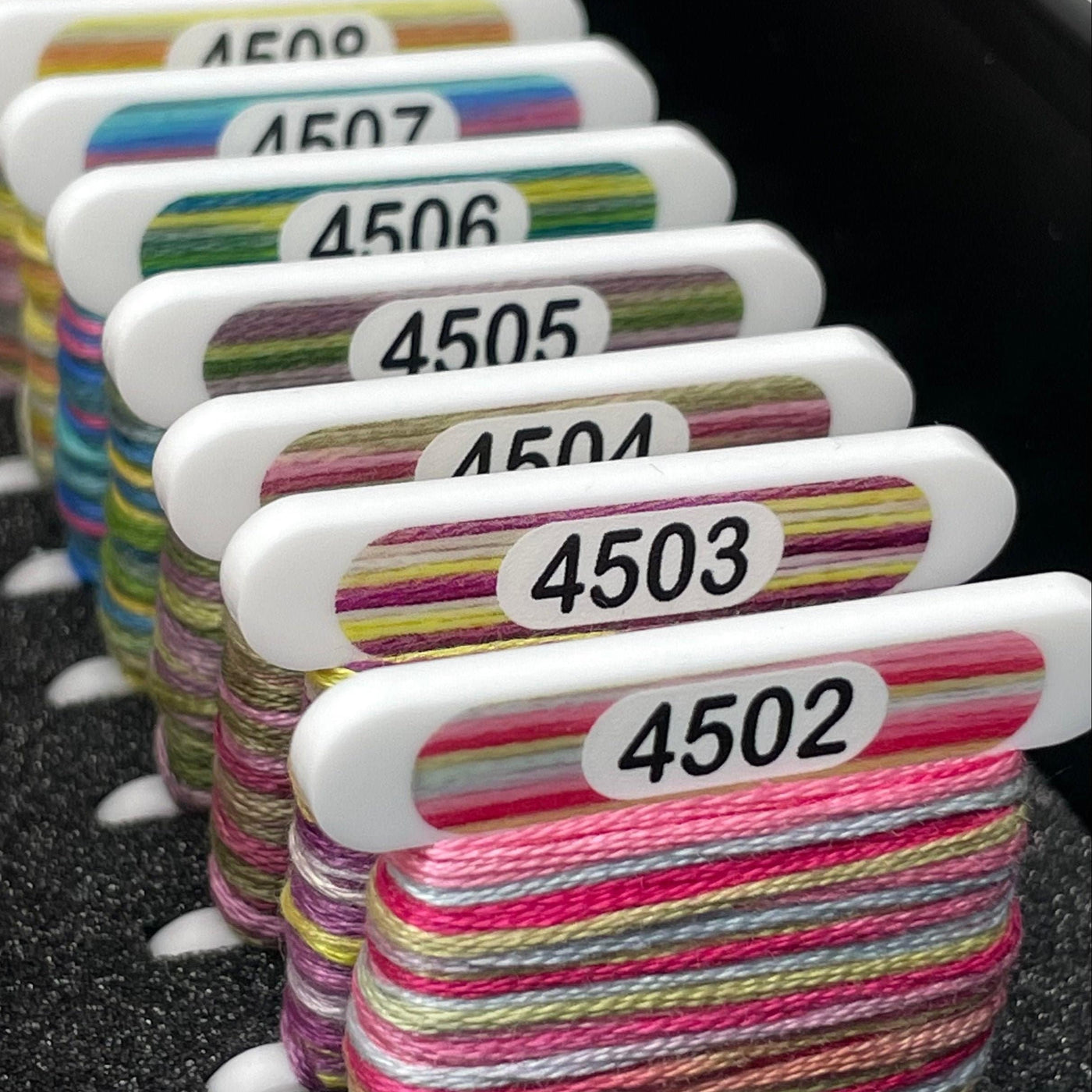 Cross stitch acrylic Bobbin with printed colour swatch for DMC Coloris