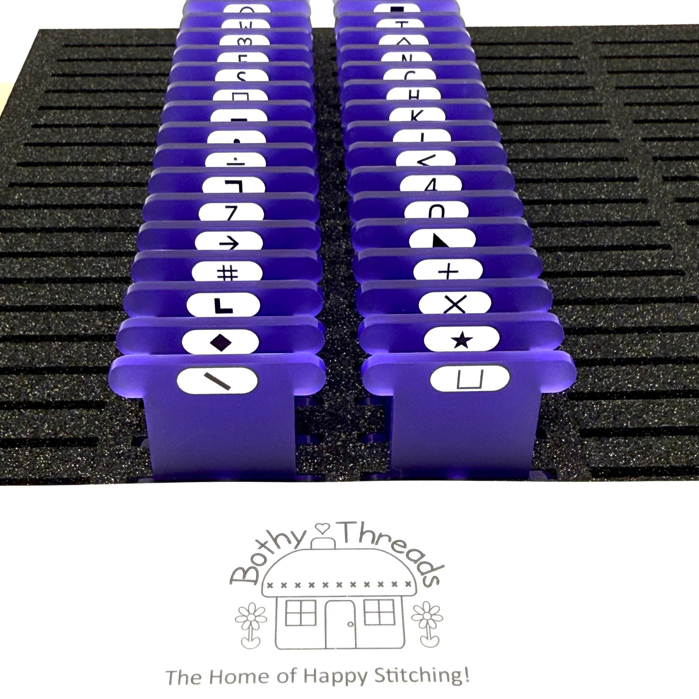 Purple Frost acrylic bobbins with printed Bothy Threads Symbols (set of 47 bobbins)