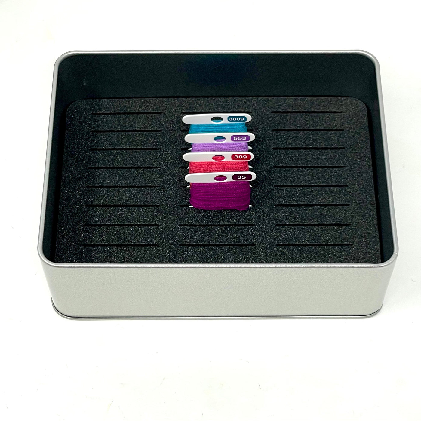 PHD Bobbin storage tin with foam insert to hold 30 bobbins for cross stitch / embroidery projects