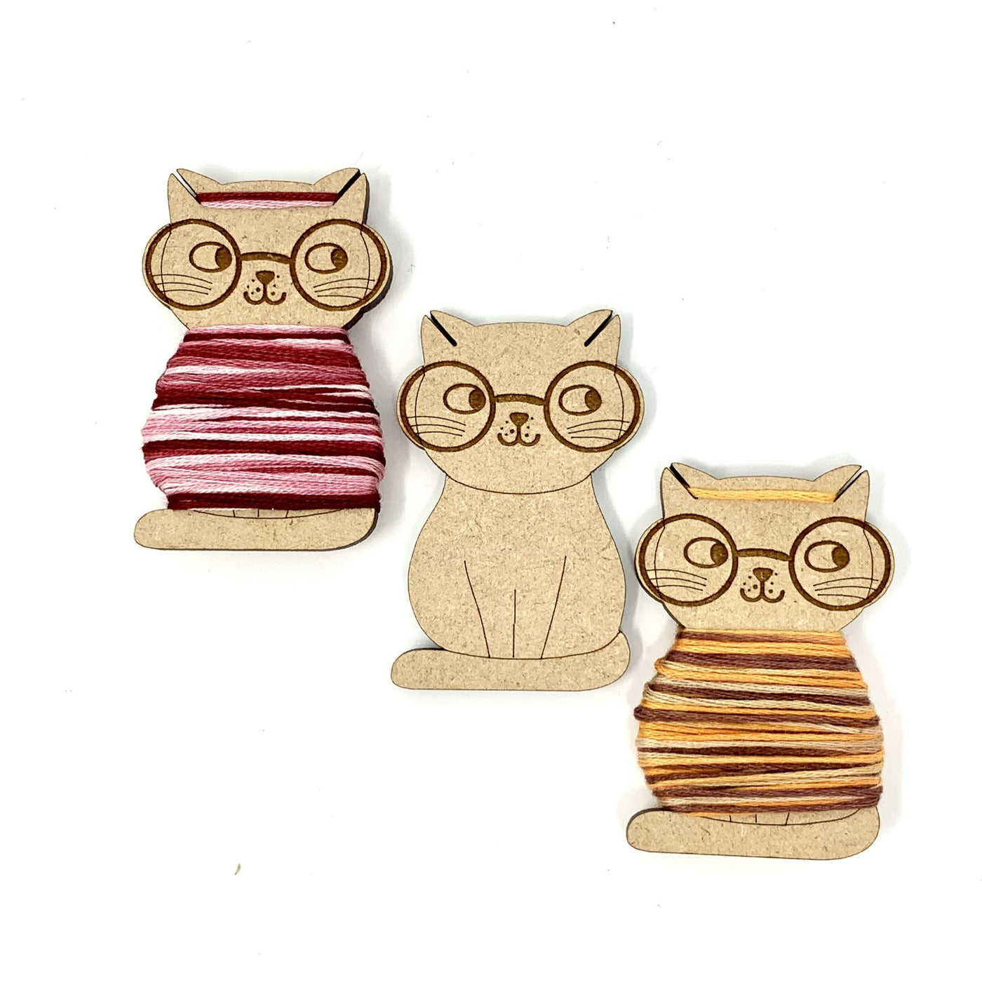 Nerdy cat shaped bobbins for storing cross stitch and embroidery threads by Pip and Chip