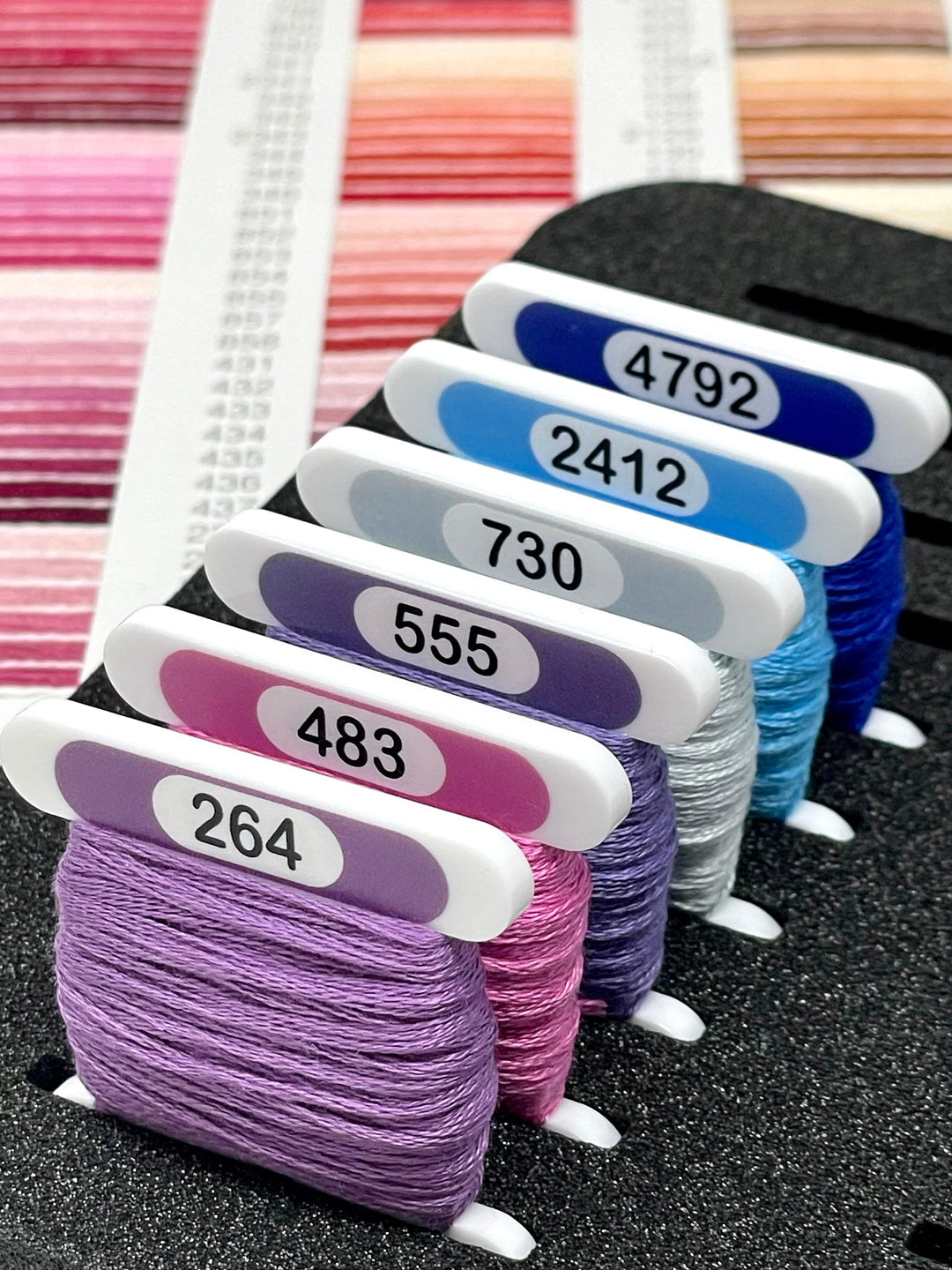 COSMO solid colours (x500) 3mm acrylic bobbins with printed number and colour swatch