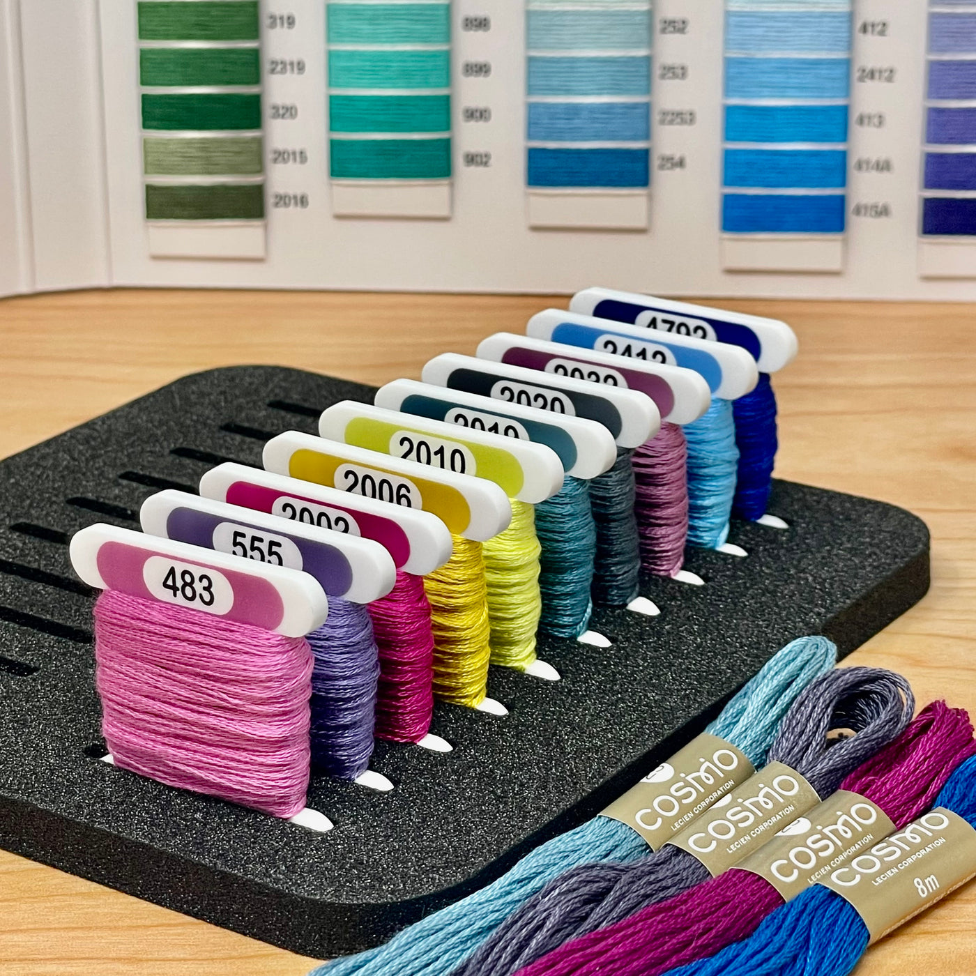 COSMO solid colours (x500) 3mm acrylic bobbins with printed number and colour swatch